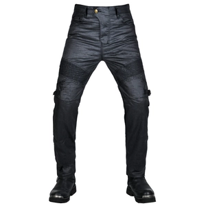 Men's motorcycle coated denim pants with elastic accordion panels at the knees and black boots