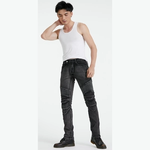 Detail view of motorcycle jeans featuring ribbed stretch panels on the knees and thighs
