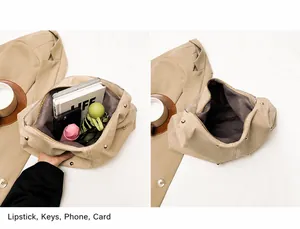 Spacious interior of khaki shoulder bag showing capacity for phone, notebook and umbrella