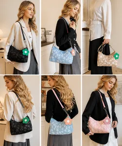Model display of floral underarm bags with chain straps in four assorted spring colors