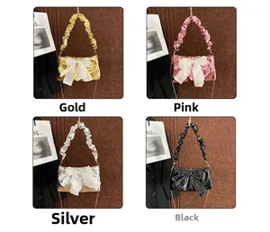 Detail view of four glossy chain bags in gold, pink, silver, and black with large bows