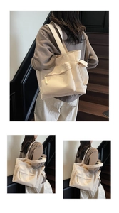Dettagli della borsa tote grande in tela con tasche laterali e tiranti per zip intrecciati