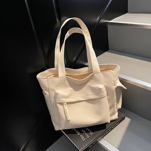 Borsa tote minimalista in tela beige con grande tasca frontale e tasche laterali per il lavoro