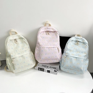 Tre simpatici zaini color pastello con motivi a gatto in crema, rosa e blu