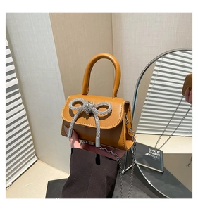 Caramel mini handbag with sparkling rhinestone bow and elegant silver chain strap