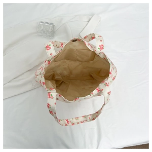 Internal view of floral tote bag with card pocket and snap closure on light lining