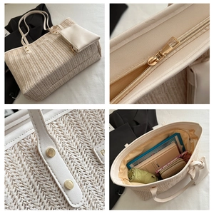 Detail view of large straw tote bag with zipper, PU leather straps and matching pouch