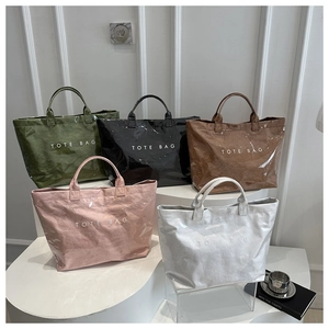 Detail showing five colors of large capacity TOTE BAGS with glossy crinkled texture