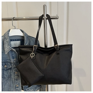 Detail of black large capacity tote bag with cross-grain texture and mini coin purse