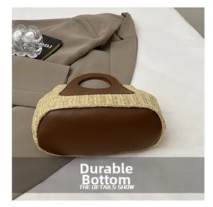 Close-up of the wear-resistant leather base on a woven bucket bag for women