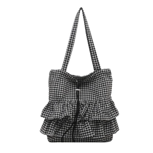 Borsa tote a quadretti bianchi e neri con bordi a balze e dettaglio con coulisse