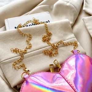 Detailed top view of a mini heart-shaped crossbody bag with laser laser gloss finish and chain