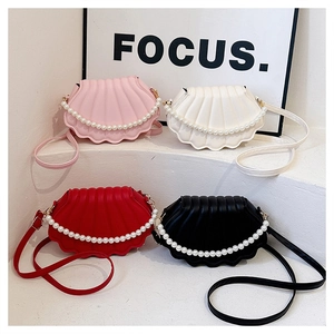 Group shot of shell-shaped pearl handle bags in pink, white, red, and black colors