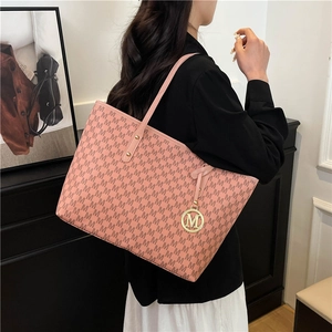 Pink tote bag with repetitive M pattern and gold hardware charm for women's daily commute