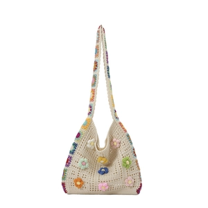 Ethnic knit crochet tote bag with colorful 3D flower appliques and granny square details