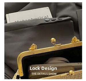 Detail of elegant gold spherical clasp on a minimalist beige woven straw handbag
