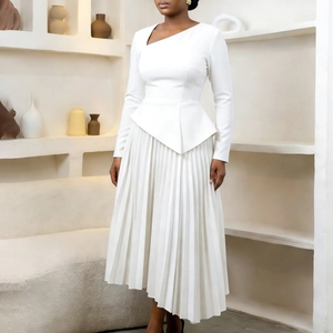 Detail of elegant white midi dress featuring asymmetric neckline and pleated peplum waist