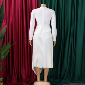 Close-up of elegant white dress showing back hidden zipper and pleated peplum skirt