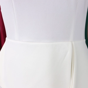 Detail of elegant white high-waisted dress with structured pleats and matte fabric texture