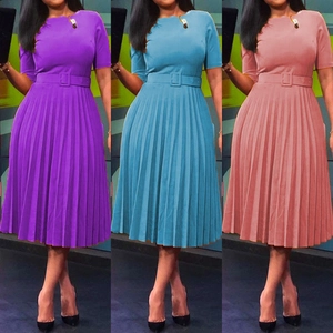 Detailed view of pleated waist dresses in purple, sky blue, and lotus pink with belts