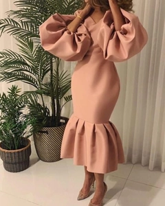 Detail of puffed long sleeves and V-neckline on a dusty pink mermaid party dress