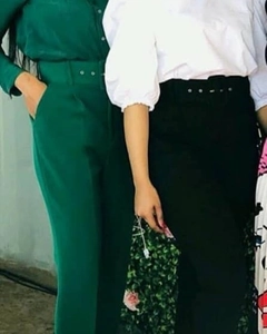 Detail of high waisted wide leg trousers with a matching belt in dark green and black