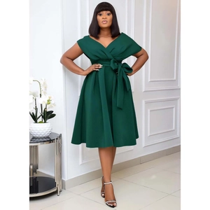 Detail of elegant dark green V-neck dress with a stylish bow waist and A-line skirt