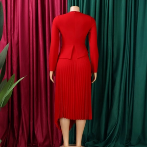 Back view of red long sleeve pleated dress with high waist detail and round neckline