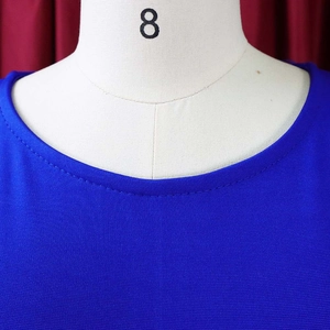 Detail of round neckline with single-needle stitching on royal blue knit dress fabric