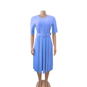 Detail of light blue short sleeve pleated dress with a matching waist belt and crew neck