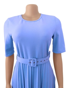 Detail of periwinkle blue pleated dress with matching belted waist and crew neck design