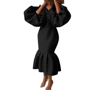 Detail of elegant black V-neck fishtail dress with dramatic puff sleeves and slim fit