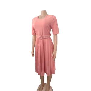Detail of pink short-sleeve pleated midi dress featuring matching adjustable waist belt