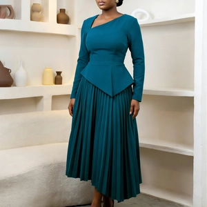 Detail of elegant dark teal dress featuring unique asymmetrical neck and pleated hem