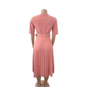 Back view of pink short sleeve pleated dress with matching waist belt for women