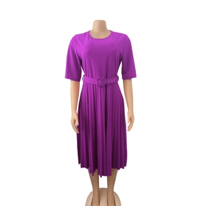 Detail of purple pleated dress with short sleeves and matching square buckle belt