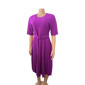 Detailed view of violet pleated midi dress featuring short sleeves and matching square buckle belt