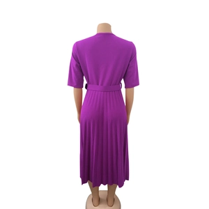 Detailed back view of magenta pleated midi dress with short sleeves and matching belt