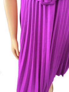 Detail shot of purple pleated dress featuring a matching fabric-covered belt buckle