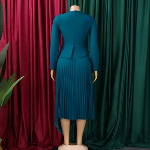 Rear view of a teal midi dress featuring a pleated skirt and elegant waist detail