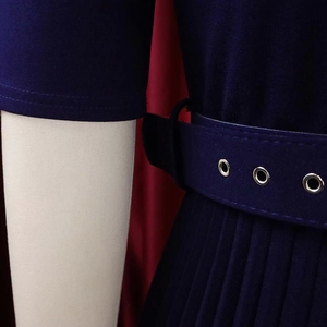 Detail of navy pleated dress showing buttoned waist belt and fine accordion pleats