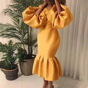 Elegant ginger yellow V-neck mermaid dress with dramatic puff sleeves and slim fit design