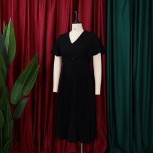 Detail of V-neckline and ruffled short sleeves on a pleated black plus size dress