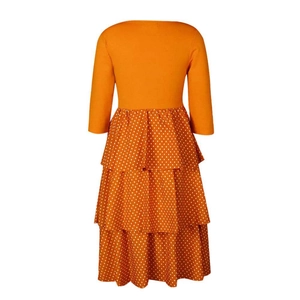 Rear view of long sleeve orange bodice and white polka dot tiered cake dress
