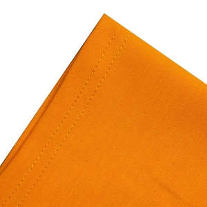 Close-up of bright orange fabric detail featuring durable double-needle stitching