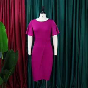 Detailed view of the ruffle sleeves and buttons on a magenta plus size pencil dress