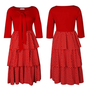 Detailed view of red tiered polka dot dress with three-layer skirt and bow neckline