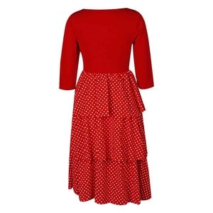 Detail of red tiered polka dot skirt with ruffled layers on a retro vintage dress