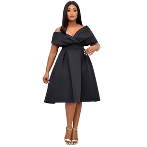 Detail of off-shoulder V-neck black evening gown with pleated high waist flared skirt