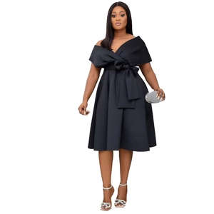 Elegant off-shoulder black A-line dress featuring a large bow waist detail and midi length